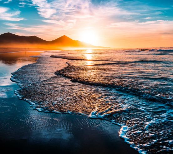 Фотошпалери Гори і сонце над морем 21487